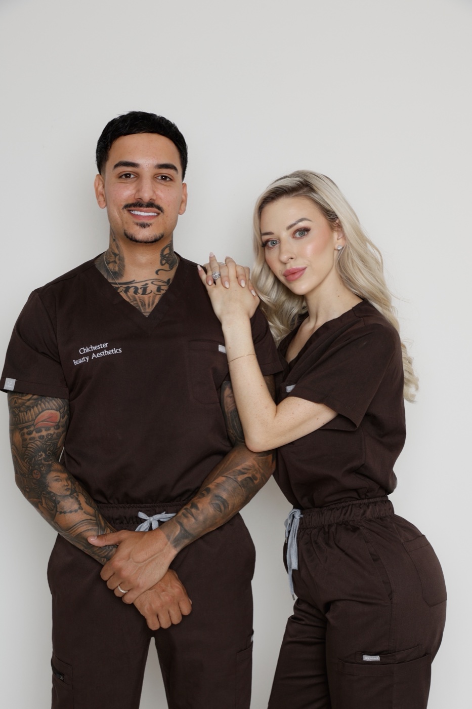 Tanisha and Michael in clinic scrubs